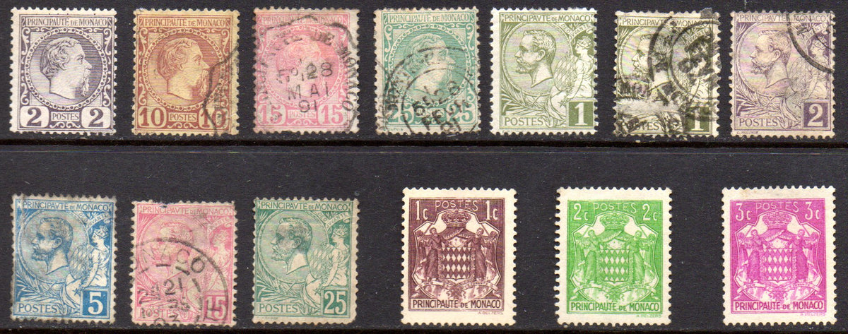 Monaco early mint and used stamp selection from 1885 onwards, featuring portraits and coat-of-arms designs, arranged in two rows.