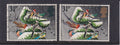 Two used Great Britain 1983 31p Christmas stamps depicting birds on snowy foliage, with a green Queen’s head variety on the left and normal gold head on the right.